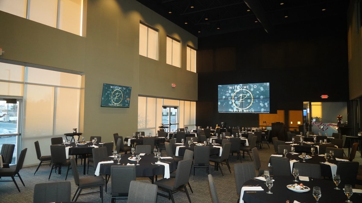 Revel Room with 12x10 ft video wall and banquet tables