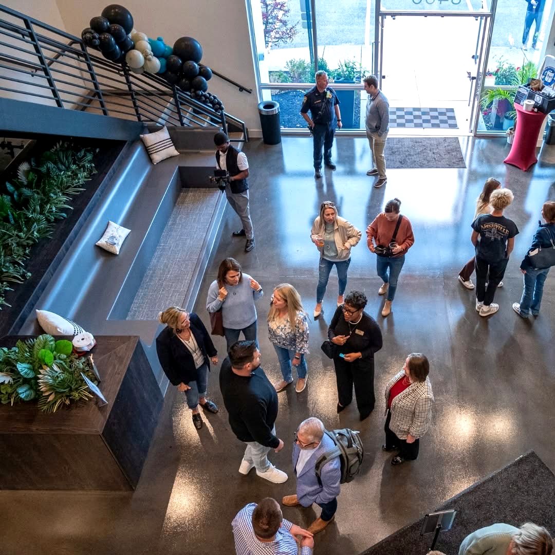 Group celebrating with cocktails at Revelance