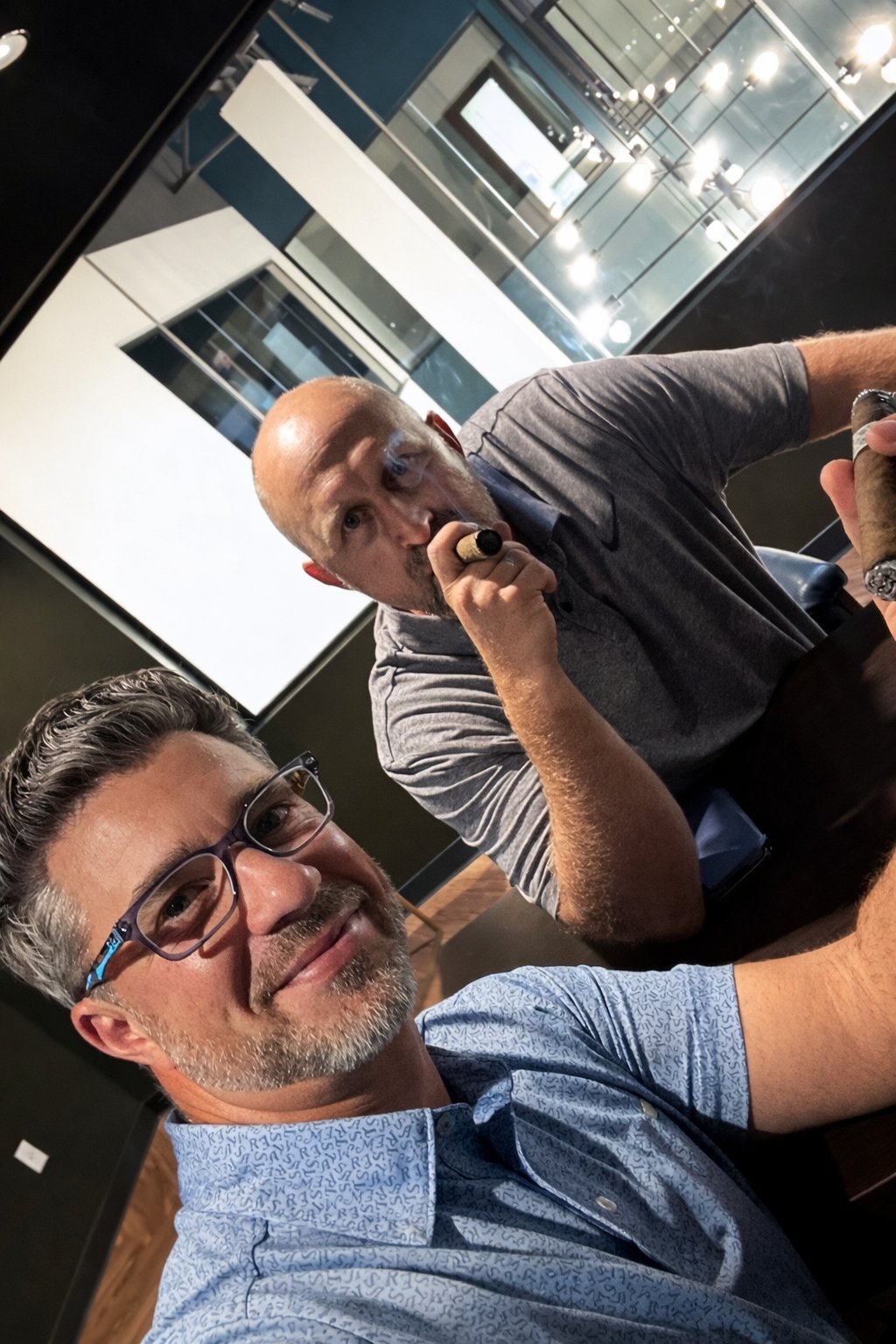 Patrick Malloy and Joe Clark in the C-Suite Lounge overlooking the building on grand opening night