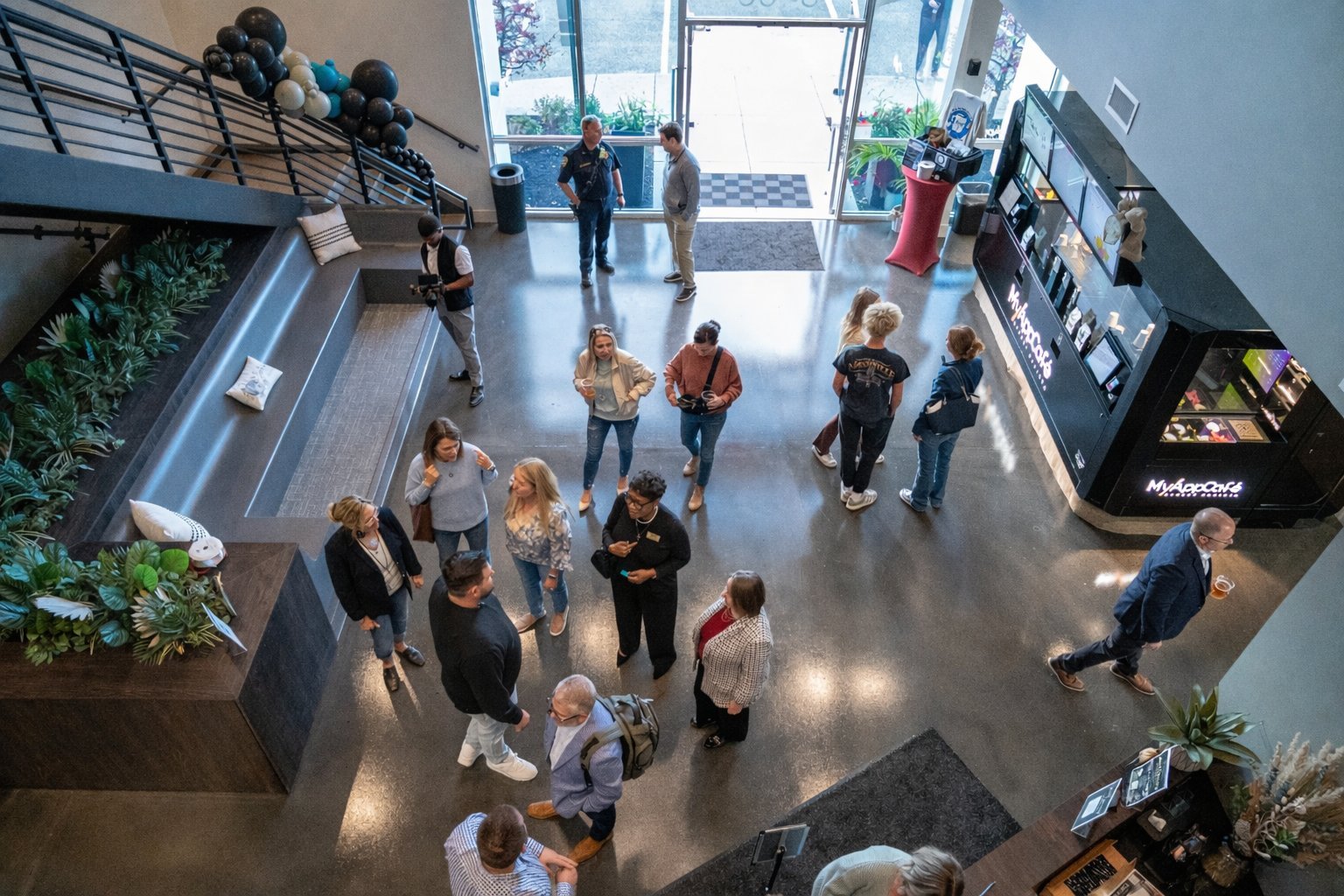 Overhead view of guests filling the Revelance lobby on grand opening night, November 2024