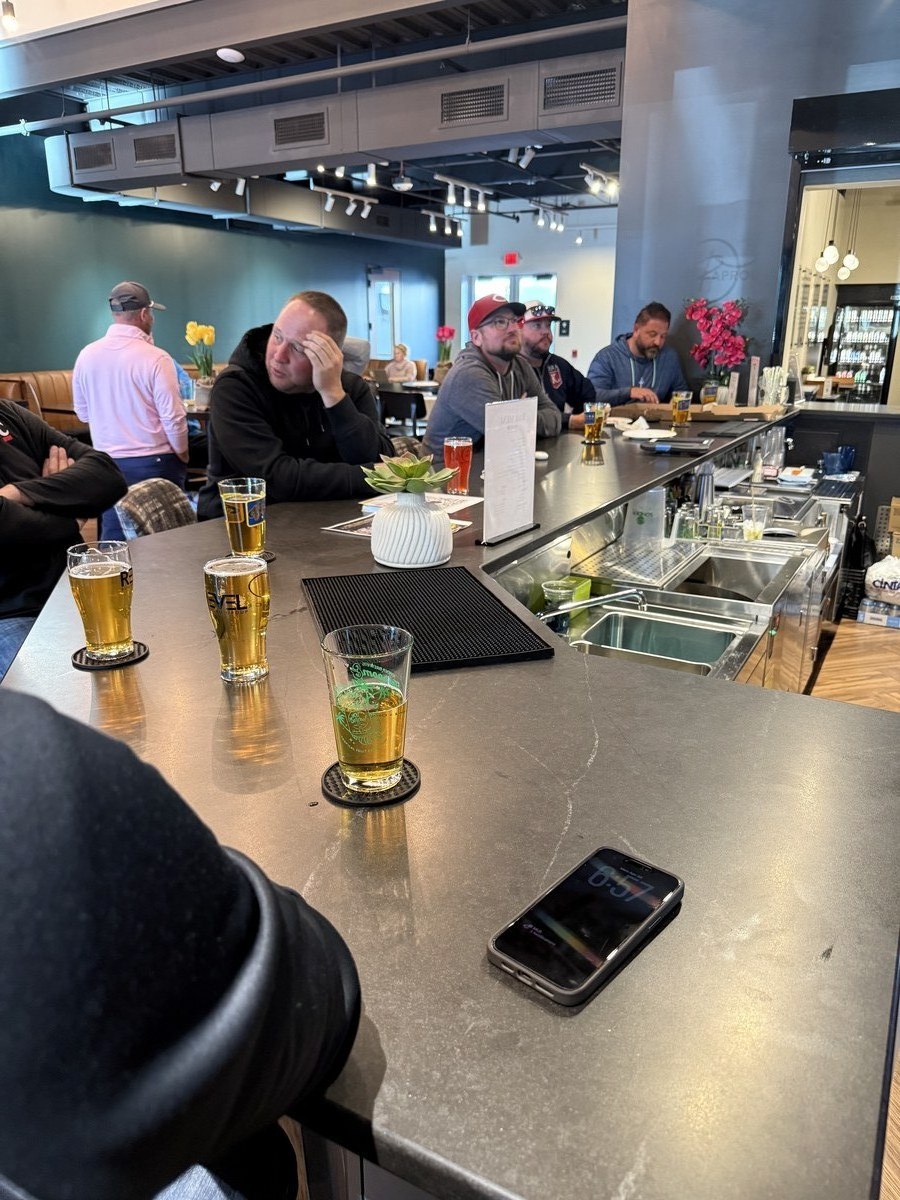 Parents at the Revelance Taphouse bar with Sonder Brewing pints during the event