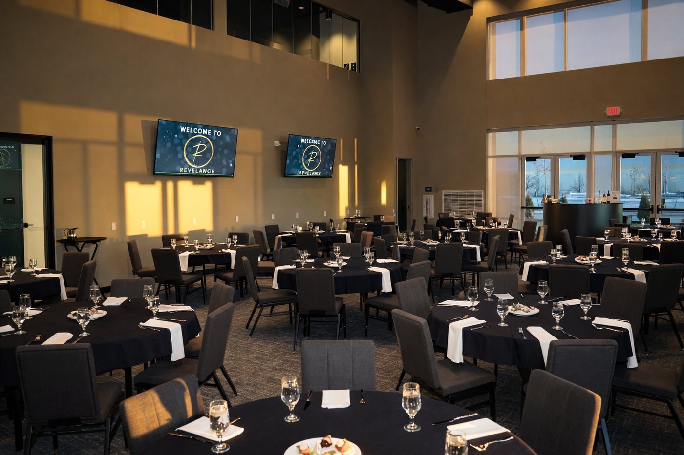 The Revel Room banquet setup with warm window light